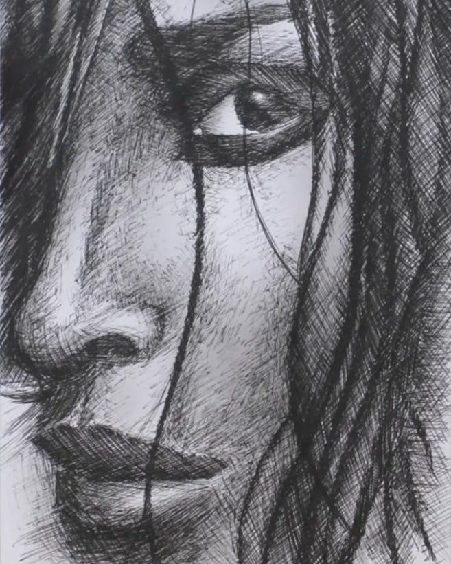 Framed black and white drawing of a face on a textured white background