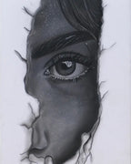 Framed artwork of a stylized face with a black border on a white background