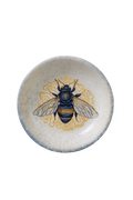 Decorative acrylic plate artwork featuring a detailed blue and gold bee surrounded by intricate golden ornamental linework.
